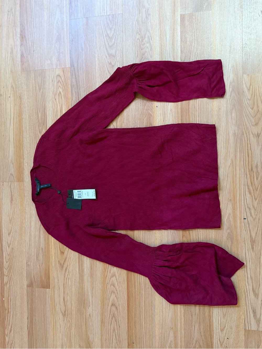 BCBGMaxAzria Waverly sweater is a cranberry red ribbed knit top